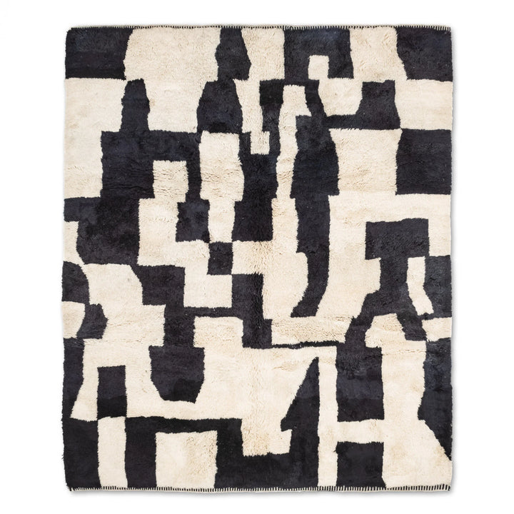 Custom Beni Mrirt rug with abstract black and cream pattern, handwoven Moroccan wool rug, modern geometric design.