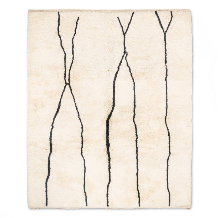 Custom Beni Mrirt Moroccan rug with black abstract lines, handcrafted wool elegance, traditional Berber motifs. Ideal for modern spaces.