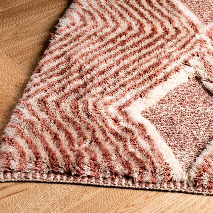 Custom Moroccan Beni Mrirt Rug with diamond and zigzag patterns, handwoven wool in rose hues, traditional and modern design.