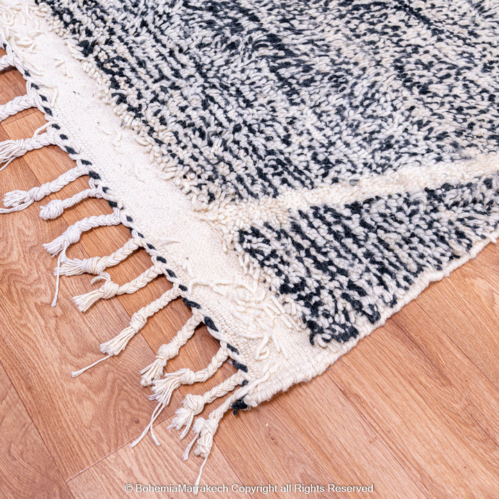 Handmade black and white Moroccan Beni Ourain rug with diamond patterns