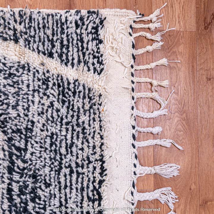 Handmade black and white Moroccan Beni Ourain rug with diamond patterns