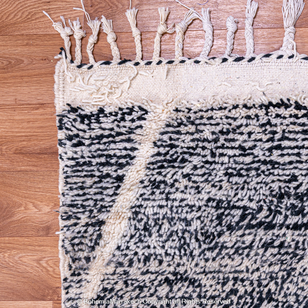 Handmade black and white Moroccan Beni Ourain rug with diamond patterns