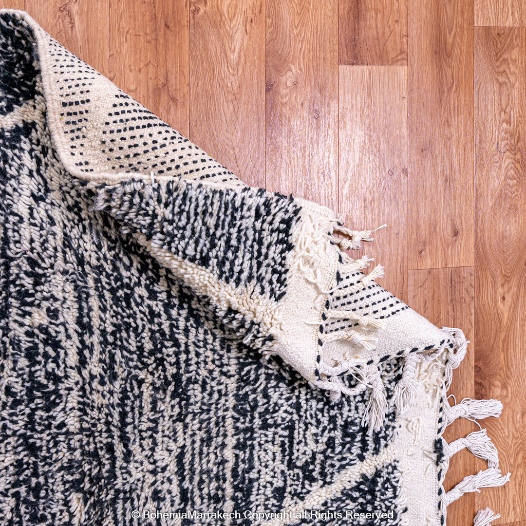 Handmade black and white Moroccan Beni Ourain rug with diamond patterns