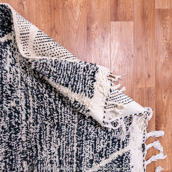 Handmade black and white Moroccan Beni Ourain rug with diamond patterns