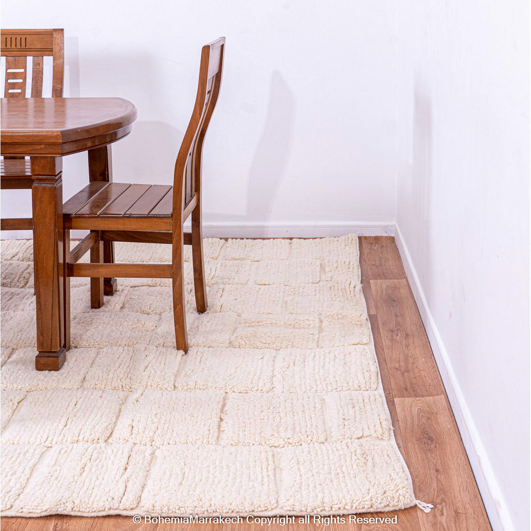 Cream Moroccan rug with minimalist grid pattern made from handwoven wool