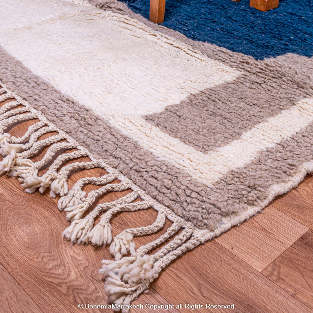 Bold navy blue Moroccan rug with beige and cream geometric border – Beni Ourain wool