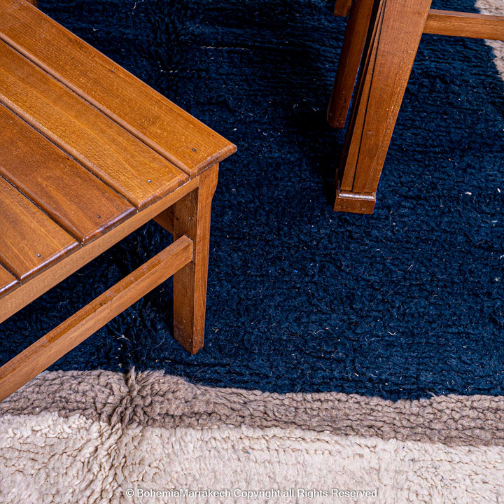 Bold navy blue Moroccan rug with beige and cream geometric border – Beni Ourain wool
