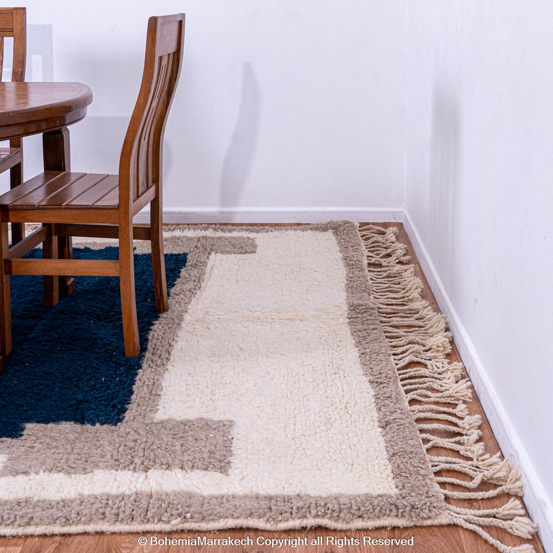 Bold navy blue Moroccan rug with beige and cream geometric border – Beni Ourain wool