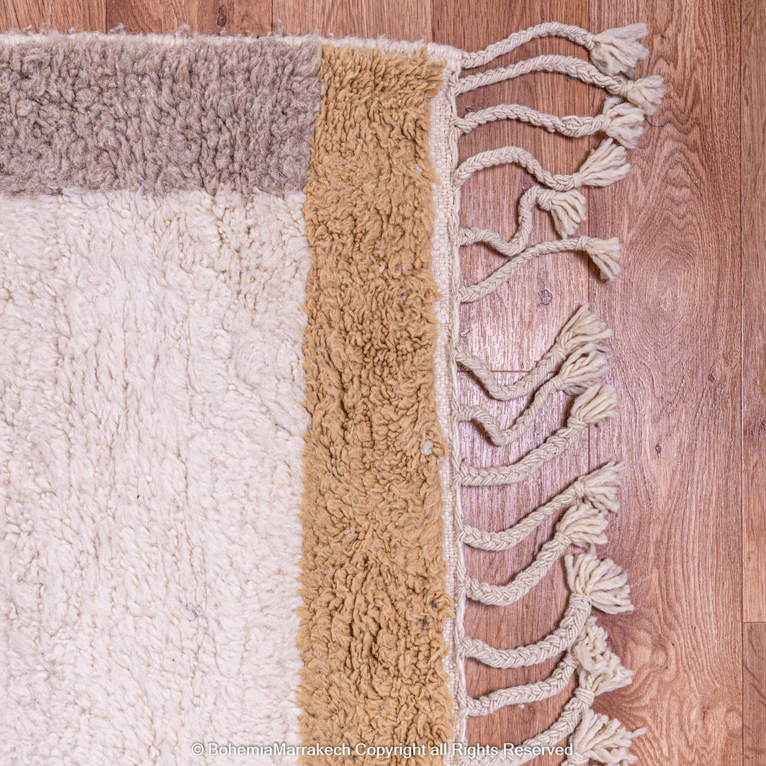 Cream Beni Ourain Moroccan rug with blue and beige borders – handmade wool