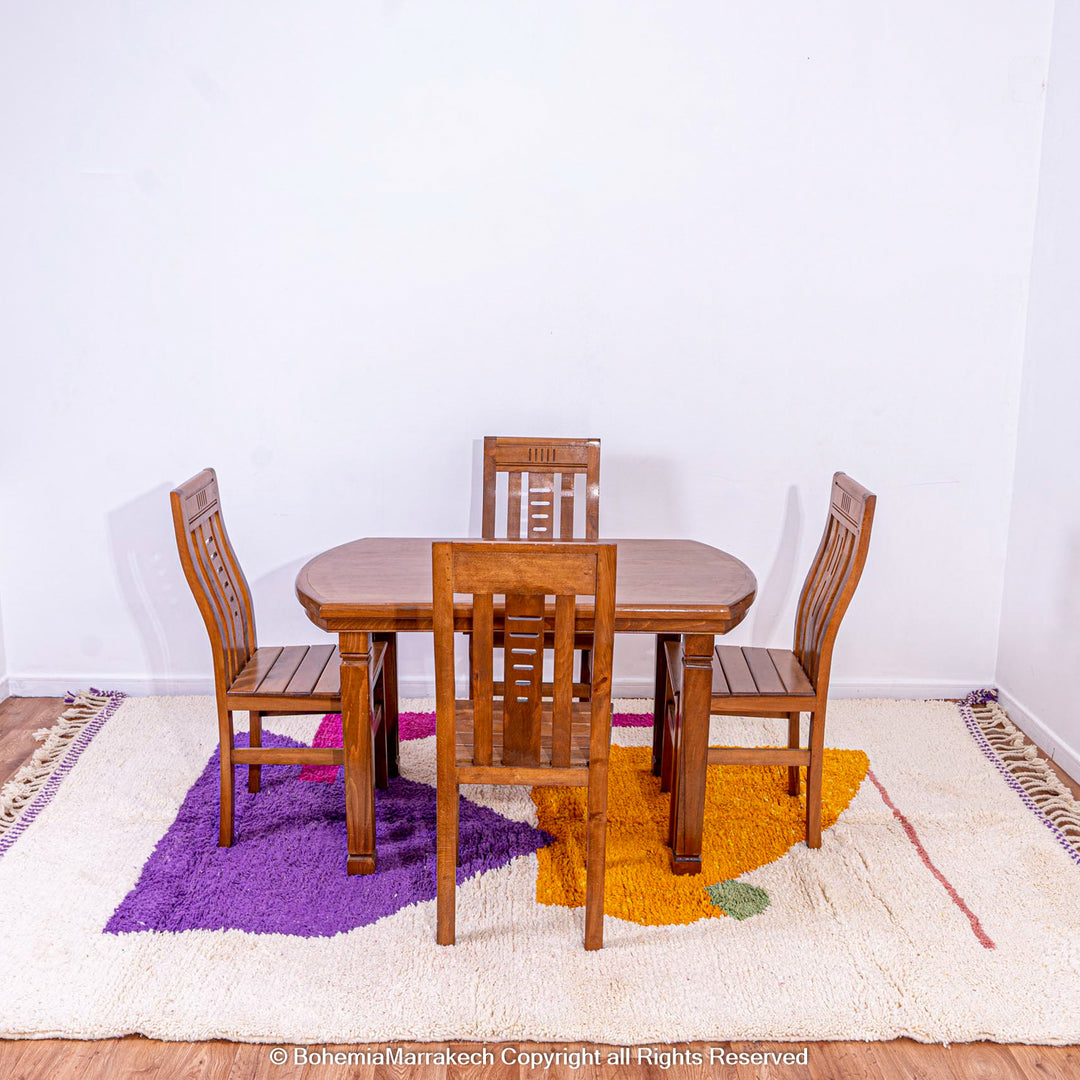 Abstract Moroccan wool rug with orange and purple geometric shapes on cream background