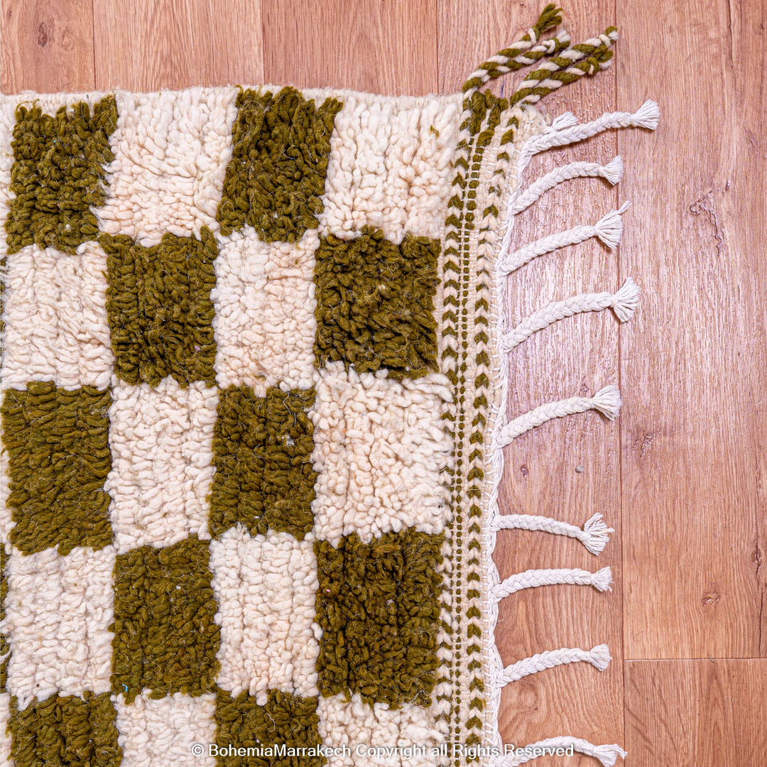 Shop a green white checkered Moroccan wool rug. Handwoven, bold, and stylish. Perfect for modern, boho, or traditional interiors.