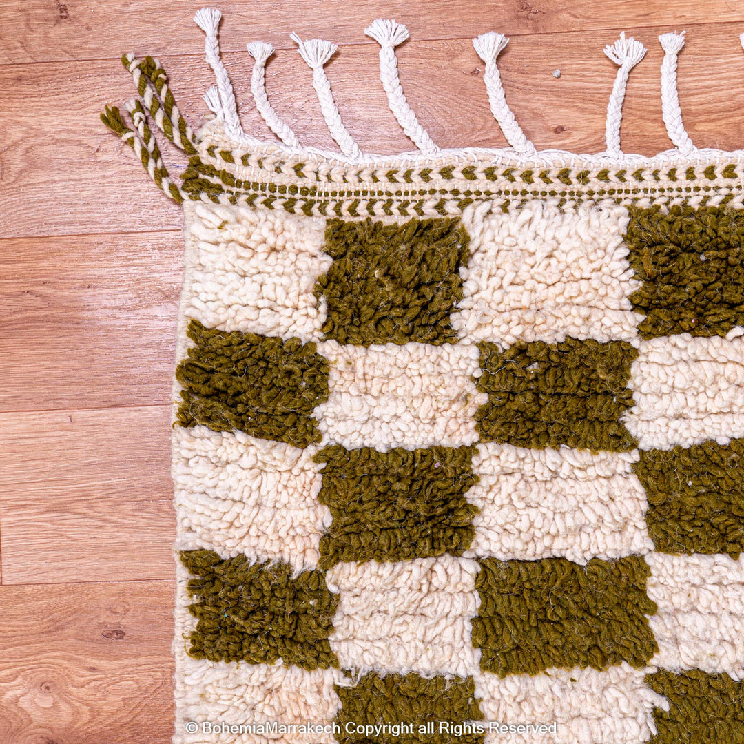 Shop a green white checkered Moroccan wool rug. Handwoven, bold, and stylish. Perfect for modern, boho, or traditional interiors.
