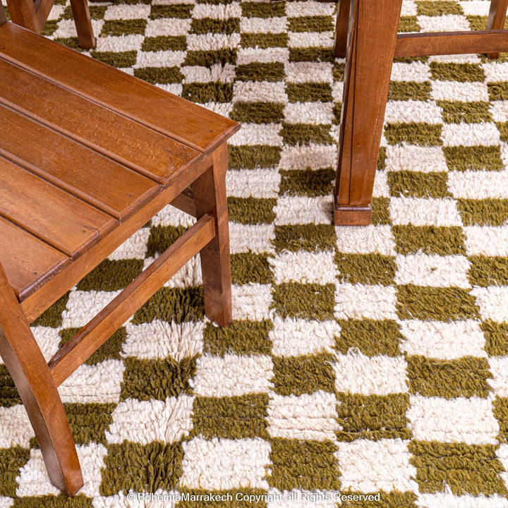 Shop a green white checkered Moroccan wool rug. Handwoven, bold, and stylish. Perfect for modern, boho, or traditional interiors.