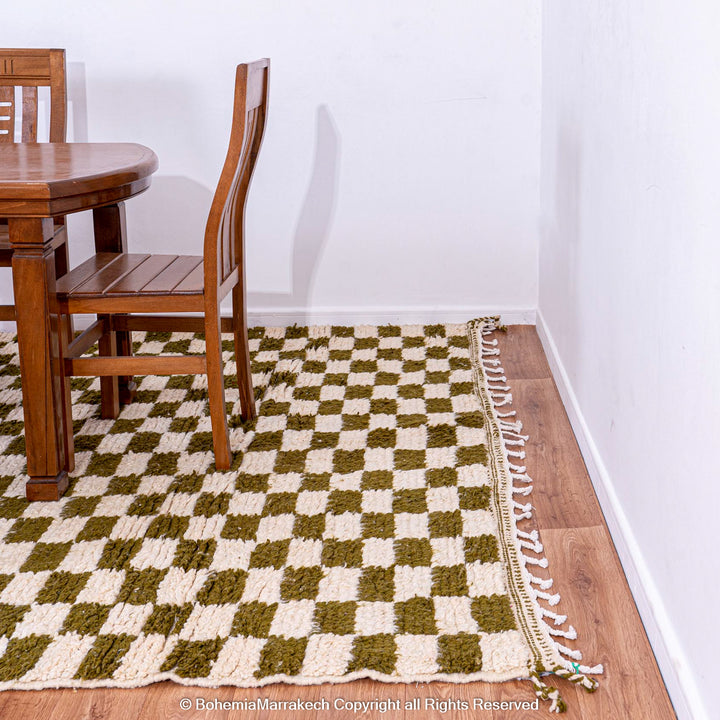 Shop a green white checkered Moroccan wool rug. Handwoven, bold, and stylish. Perfect for modern, boho, or traditional interiors.