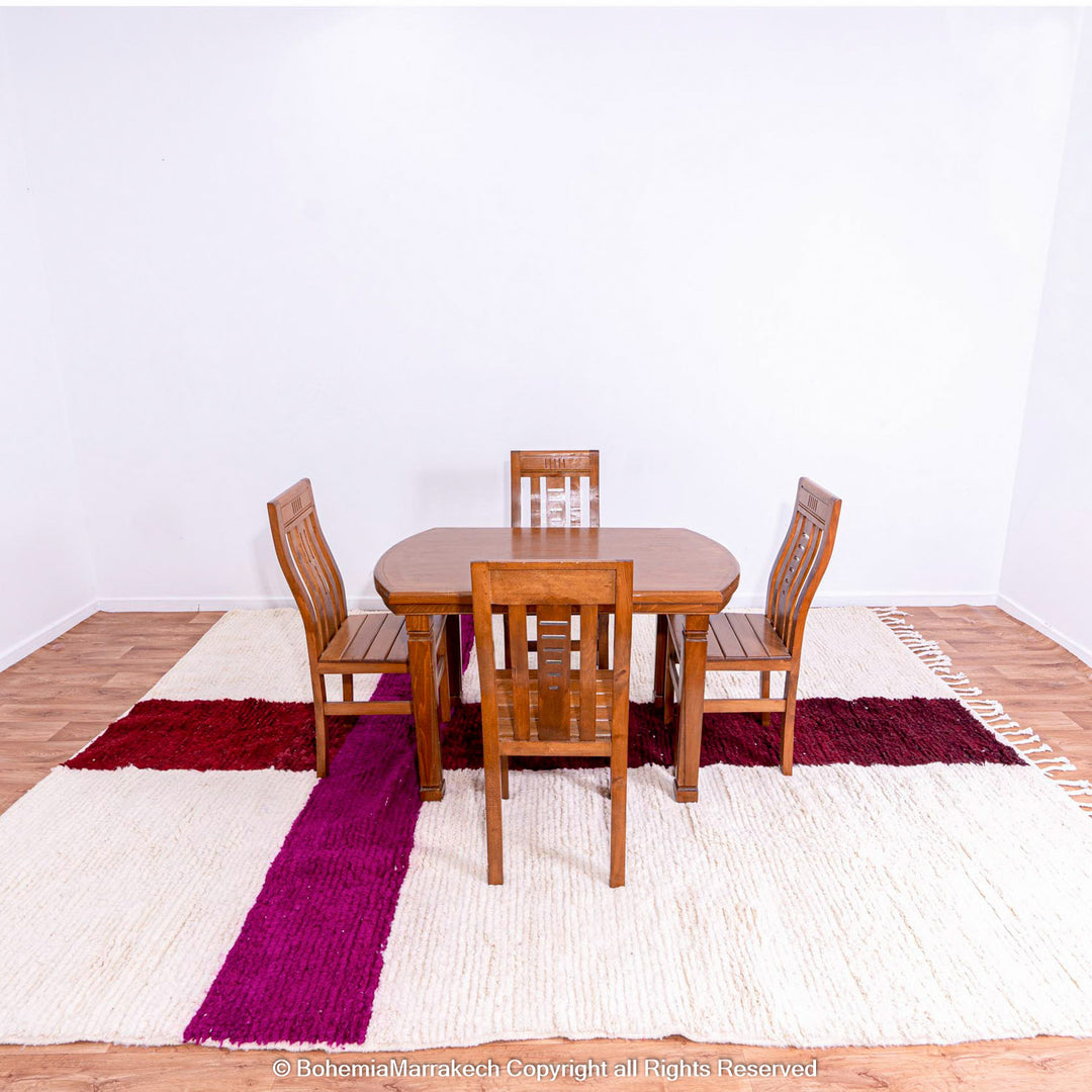 Handmade Moroccan wool rug with burgundy and magenta cross on ivory background – Beni Ourain style