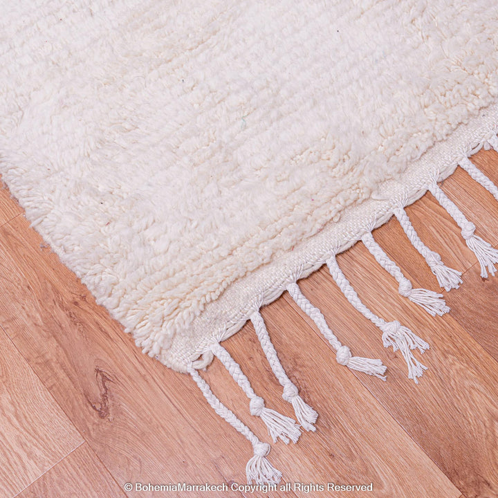 Handmade Moroccan wool rug with burgundy and magenta cross on ivory background – Beni Ourain style