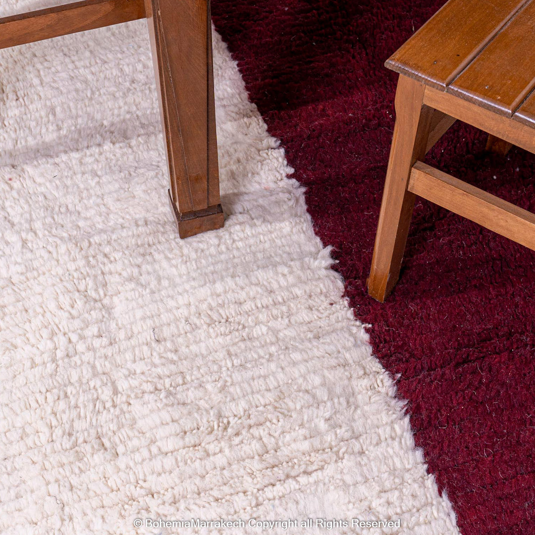 Handmade Moroccan wool rug with burgundy and magenta cross on ivory background – Beni Ourain style