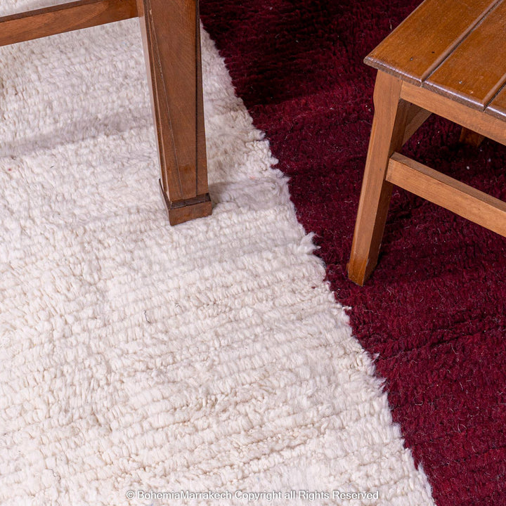 Handmade Moroccan wool rug with burgundy and magenta cross on ivory background – Beni Ourain style