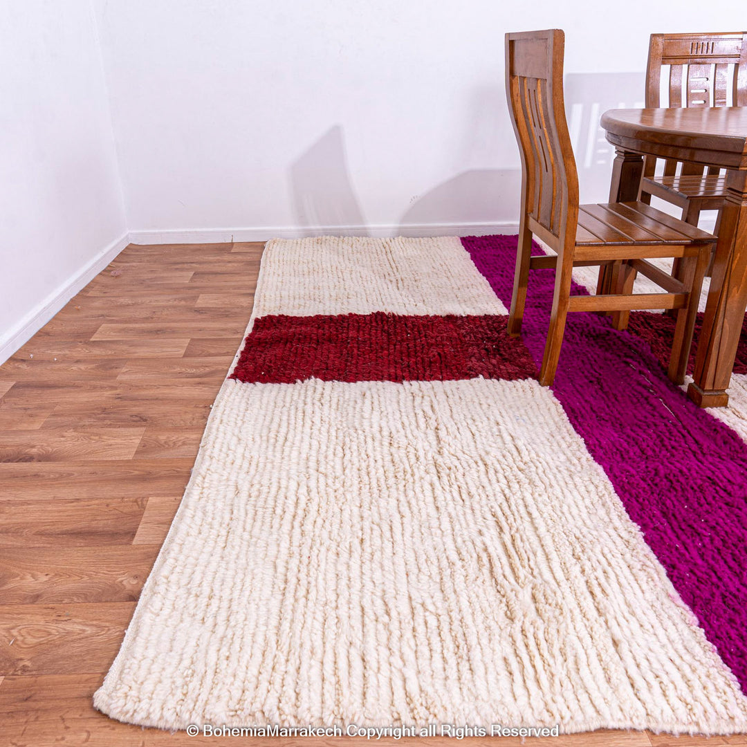 Handmade Moroccan wool rug with burgundy and magenta cross on ivory background – Beni Ourain style