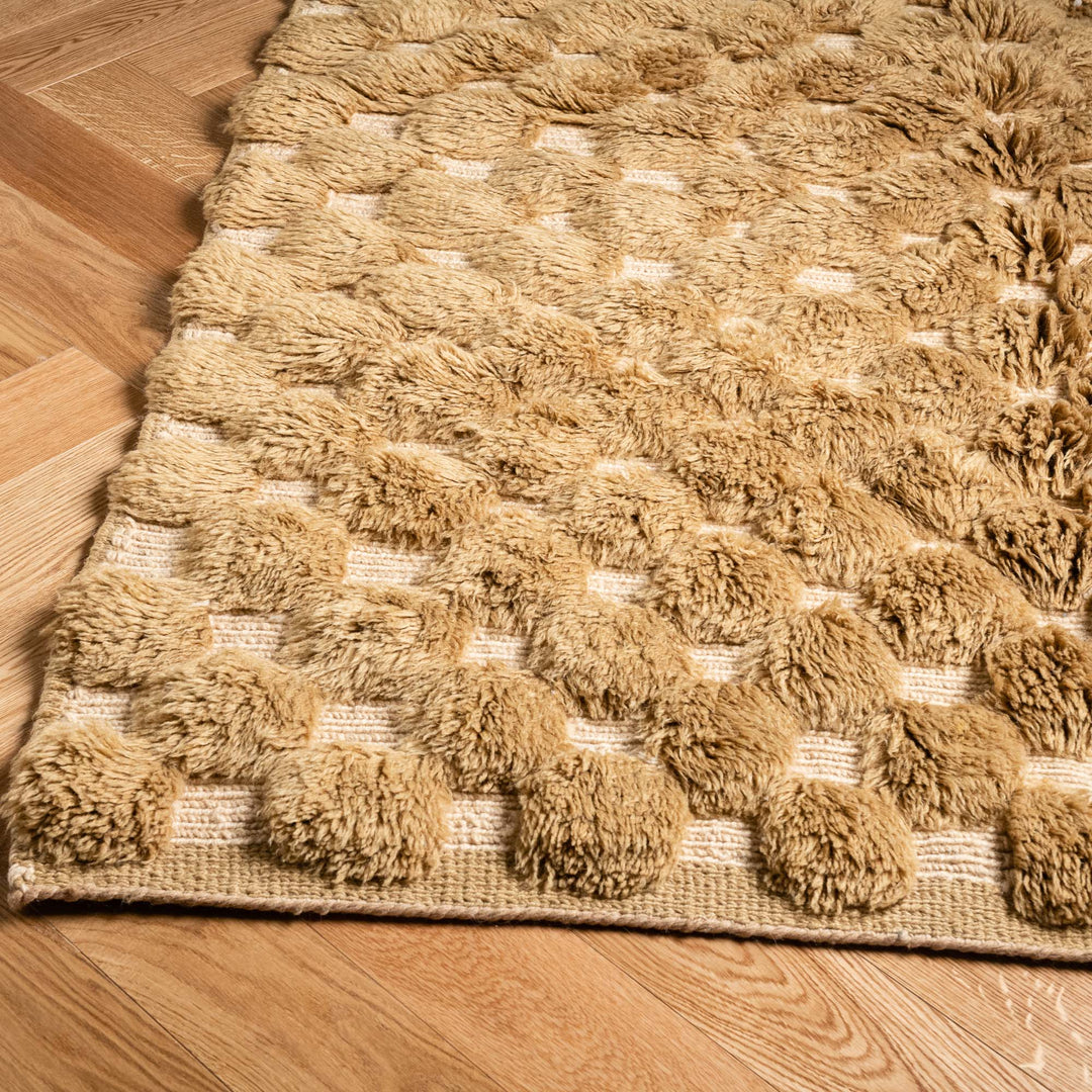 Custom handmade Moroccan rug with textured Berber pattern in warm tones, perfect for boho and modern interiors.