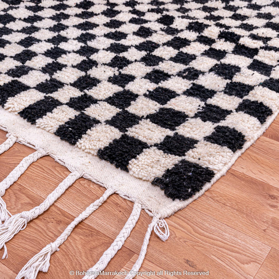 Black and white checkered Moroccan rug, handcrafted in wool, perfect for modern interiors. Available as a Moroccan Berber carpet.