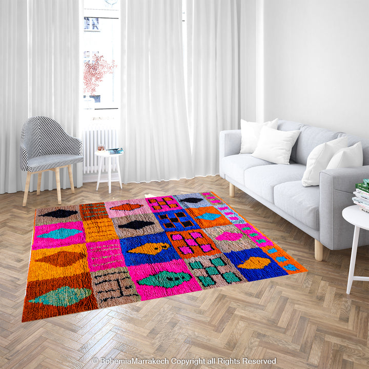 Colorful Moroccan wool rug with geometric patterns in pink, blue, and orange, enhancing a modern living room's decor.