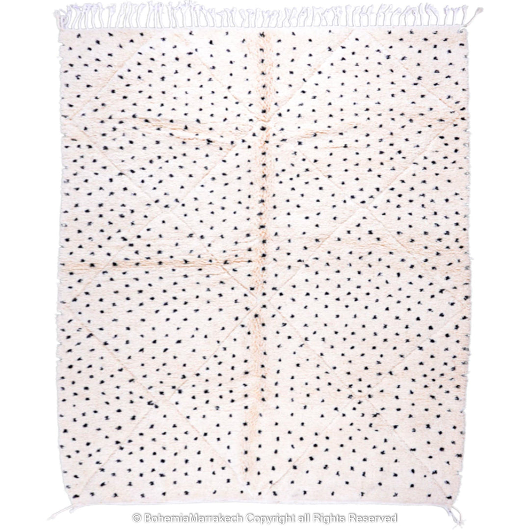 White Moroccan Beni Ourain rug with black dots, handmade from natural wool, perfect for modern and traditional interiors.