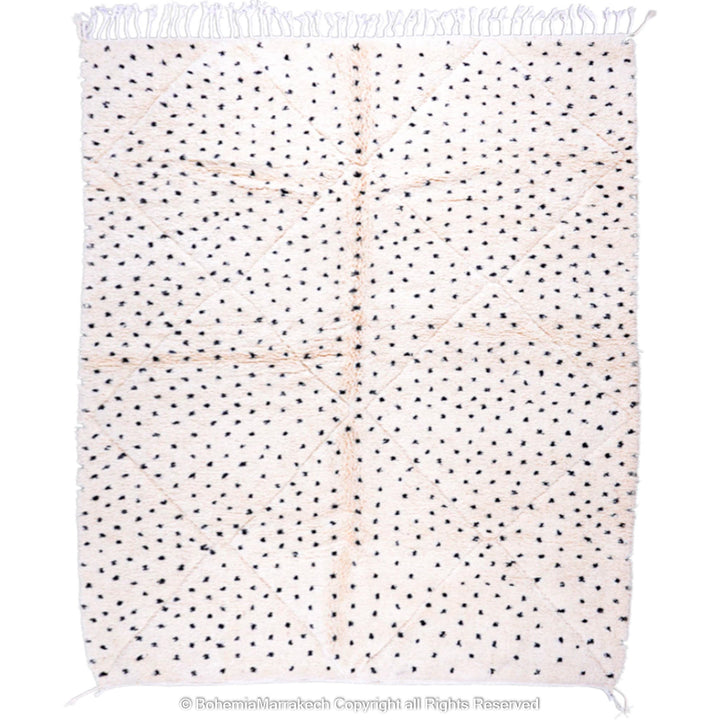 White Moroccan Beni Ourain rug with black dots, handmade from natural wool, perfect for modern and traditional interiors.
