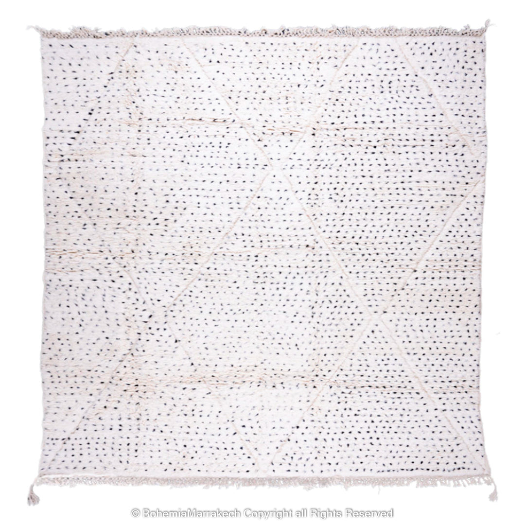 White Moroccan Berber rug with black dots and diamond pattern, handcrafted from natural wool, ideal for minimalist and boho interiors.