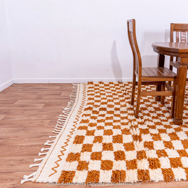 Yellow white checkered Moroccan wool rug in dining room, traditional Berber design, handmade for modern interiors.