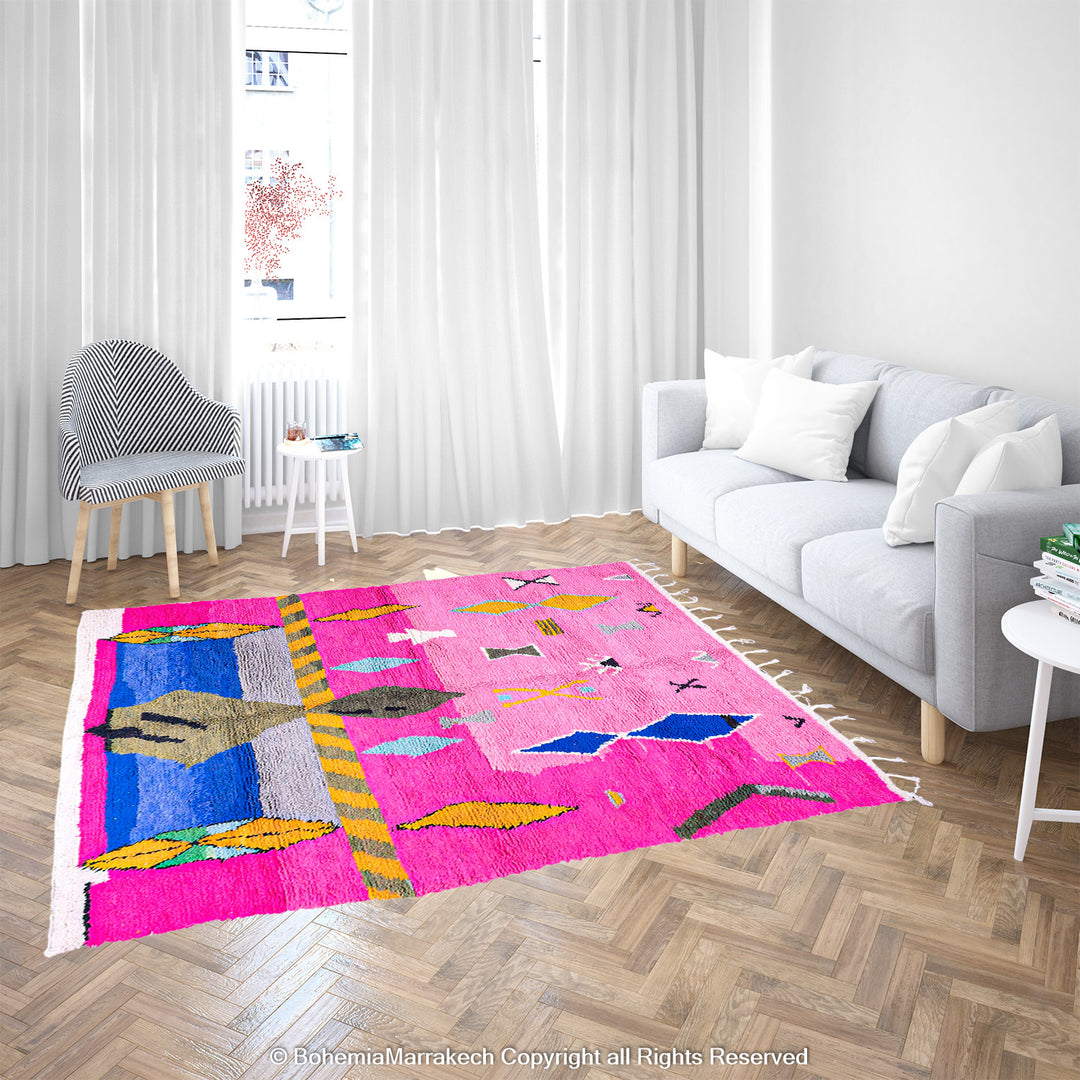 Handmade pink Moroccan rug with multicolor tribal geometric motifs, crafted in wool by Berber artisans