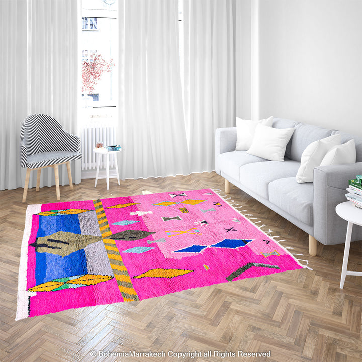 Handmade pink Moroccan rug with multicolor tribal geometric motifs, crafted in wool by Berber artisans