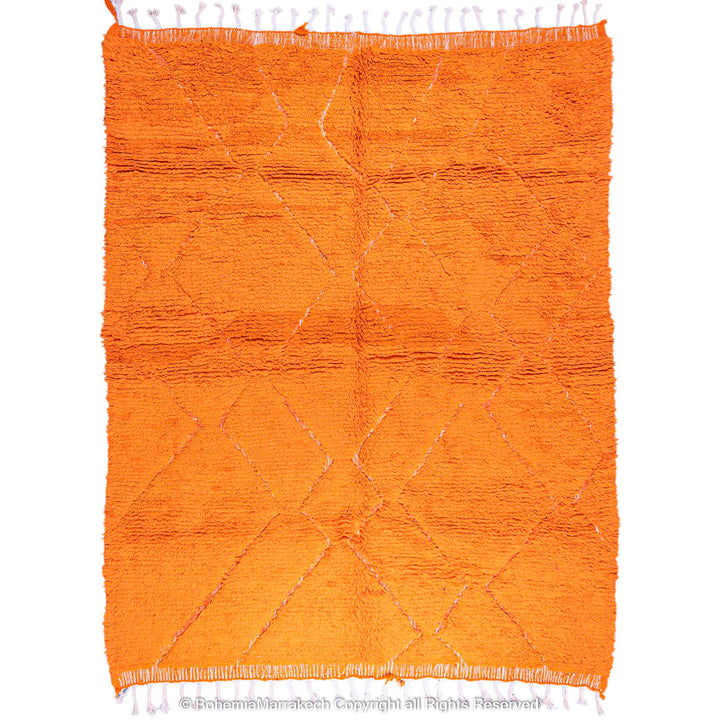 Handmade orange Moroccan rug with subtle diamond pattern and soft wool texture