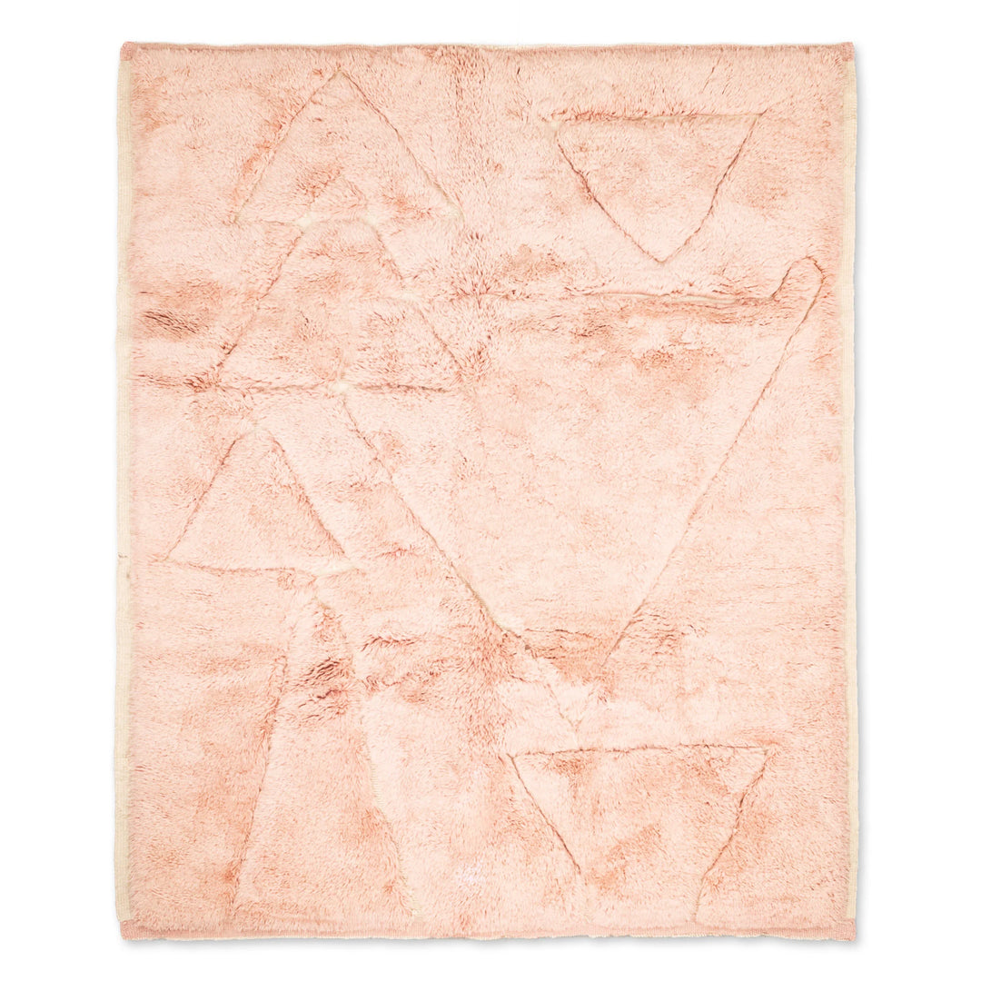 Custom pink Moroccan rug with abstract triangle motifs, traditional hand-carved wool design. Perfect for modern and boho interiors.