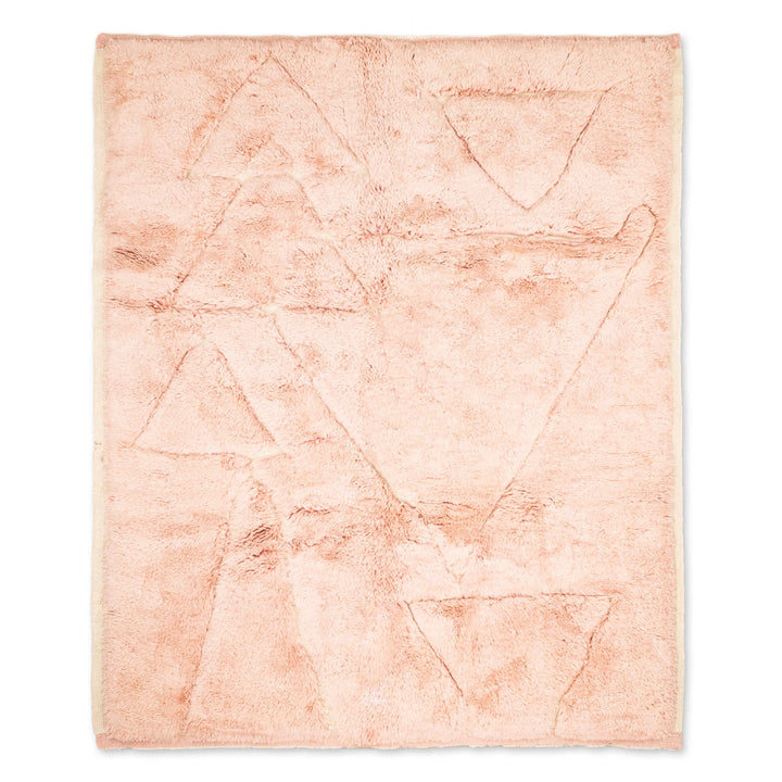 Custom pink Moroccan rug with abstract triangle motifs, traditional hand-carved wool design. Perfect for modern and boho interiors.