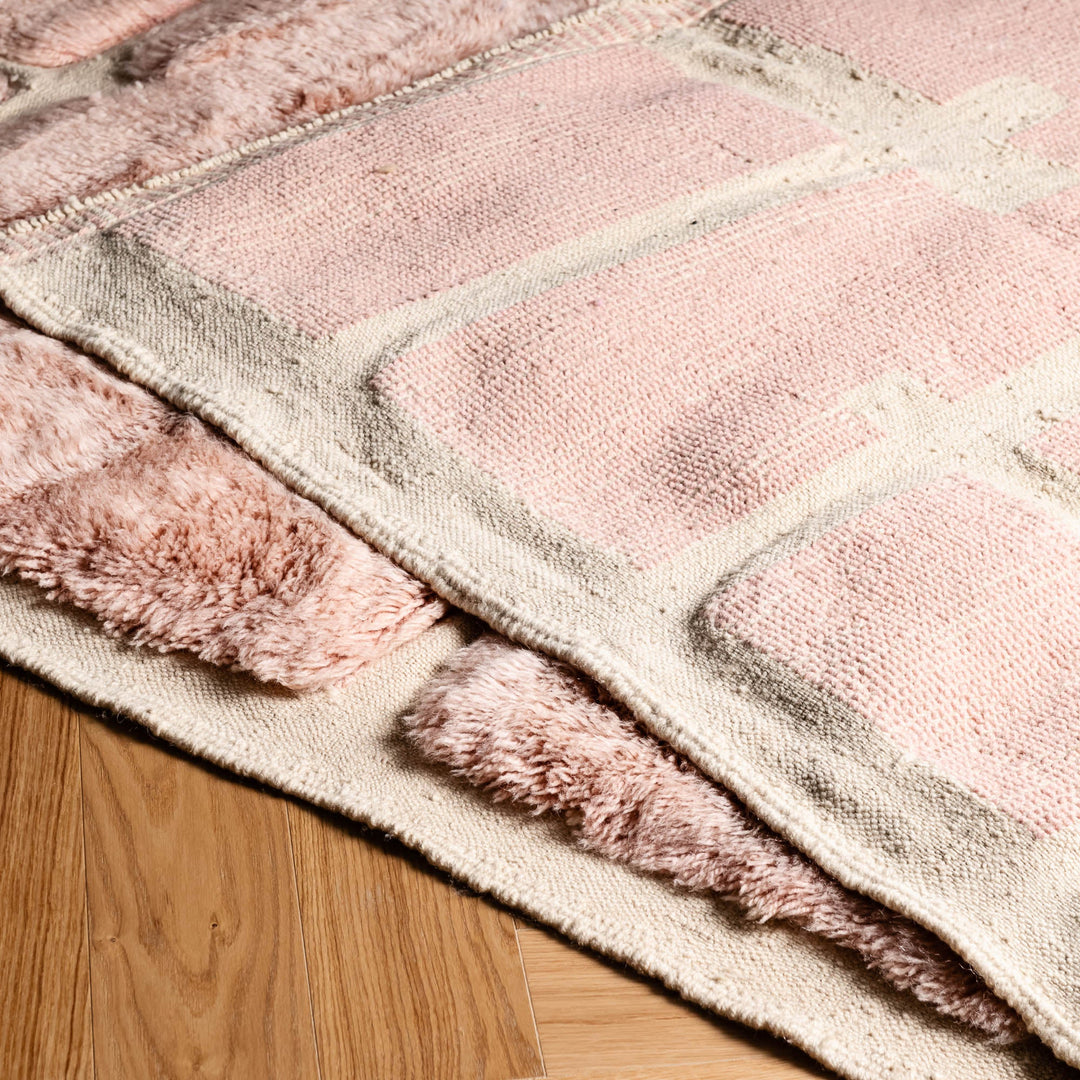 Custom soft pink Moroccan rug with modern brick pattern, plush wool texture, elegant design, perfect for chic living spaces.