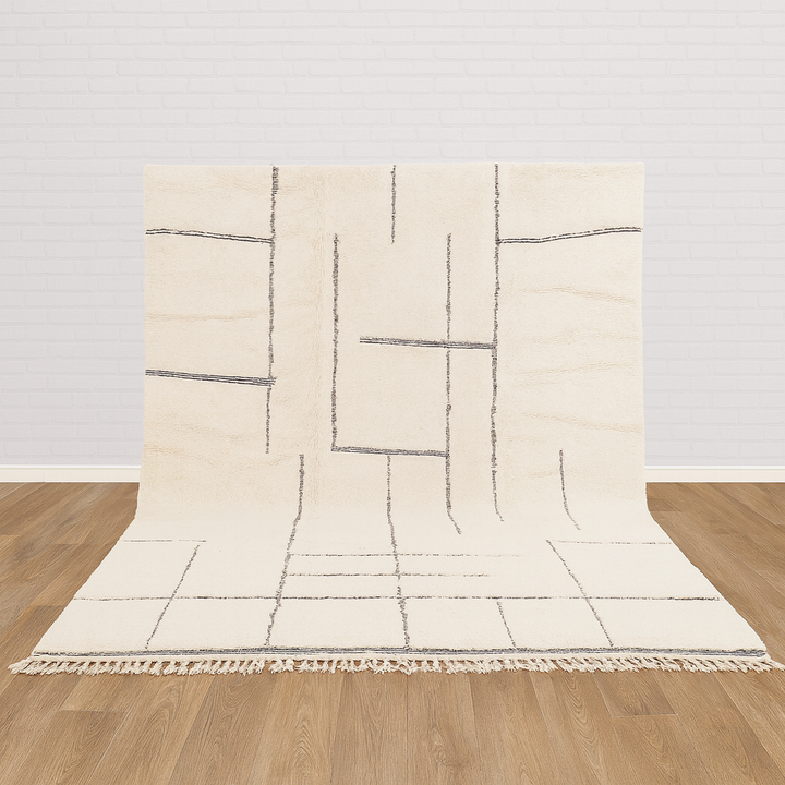 Beige rug with geometric pattern on a wooden floor