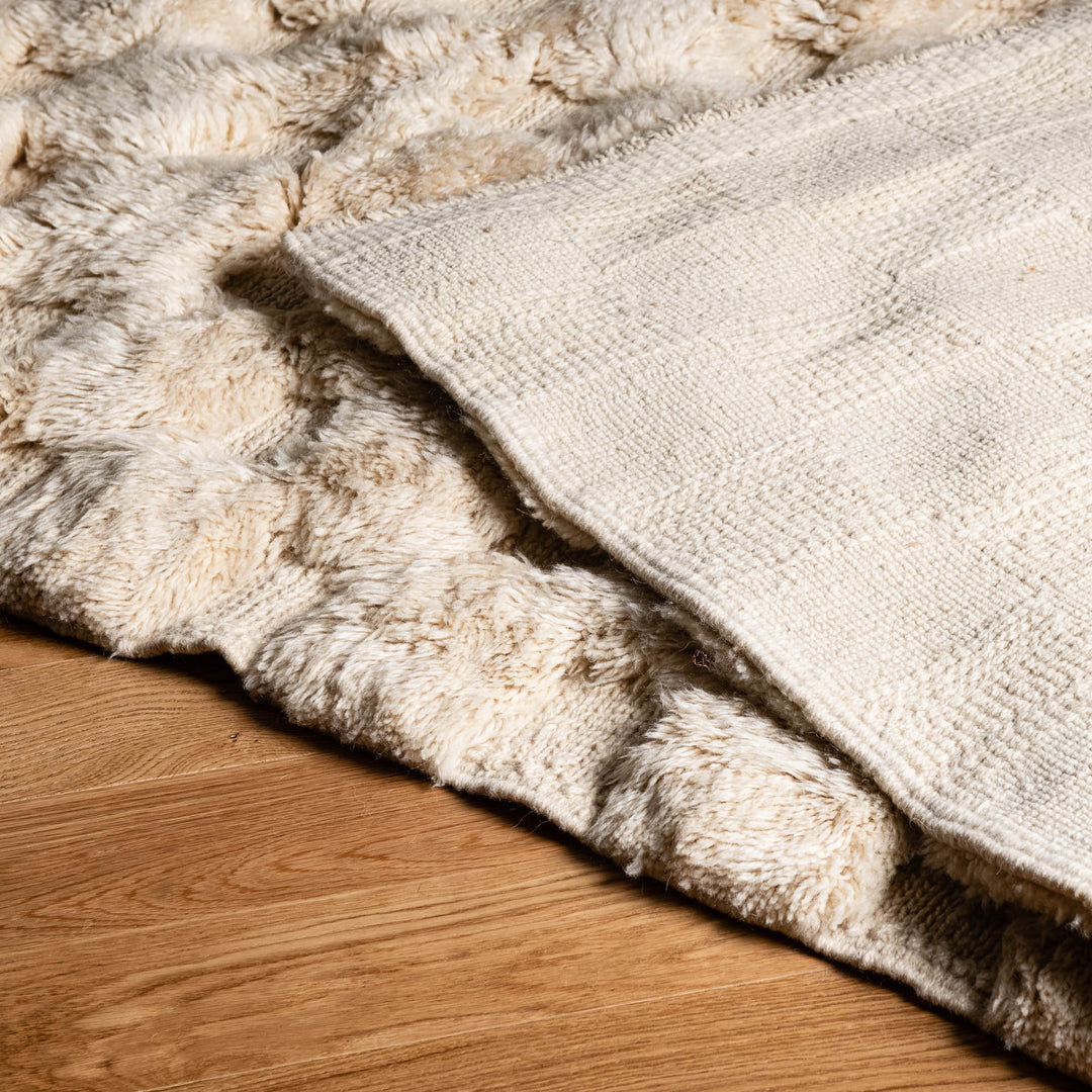 Custom handwoven Moroccan wool rug with raised texture, ideal for contemporary interiors. Moroccan berber carpet for sale.