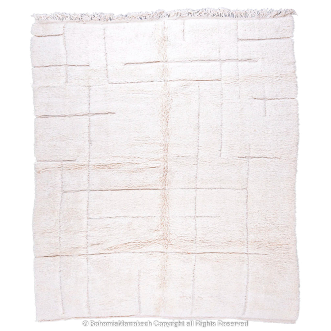 Minimalist Moroccan rug in off-white with a subtle grid pattern, handmade from natural wool by Berber artisans, ideal for modern decor.