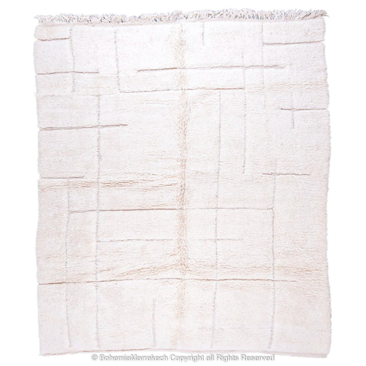 Minimalist Moroccan rug in off-white with a subtle grid pattern, handmade from natural wool by Berber artisans, ideal for modern decor.