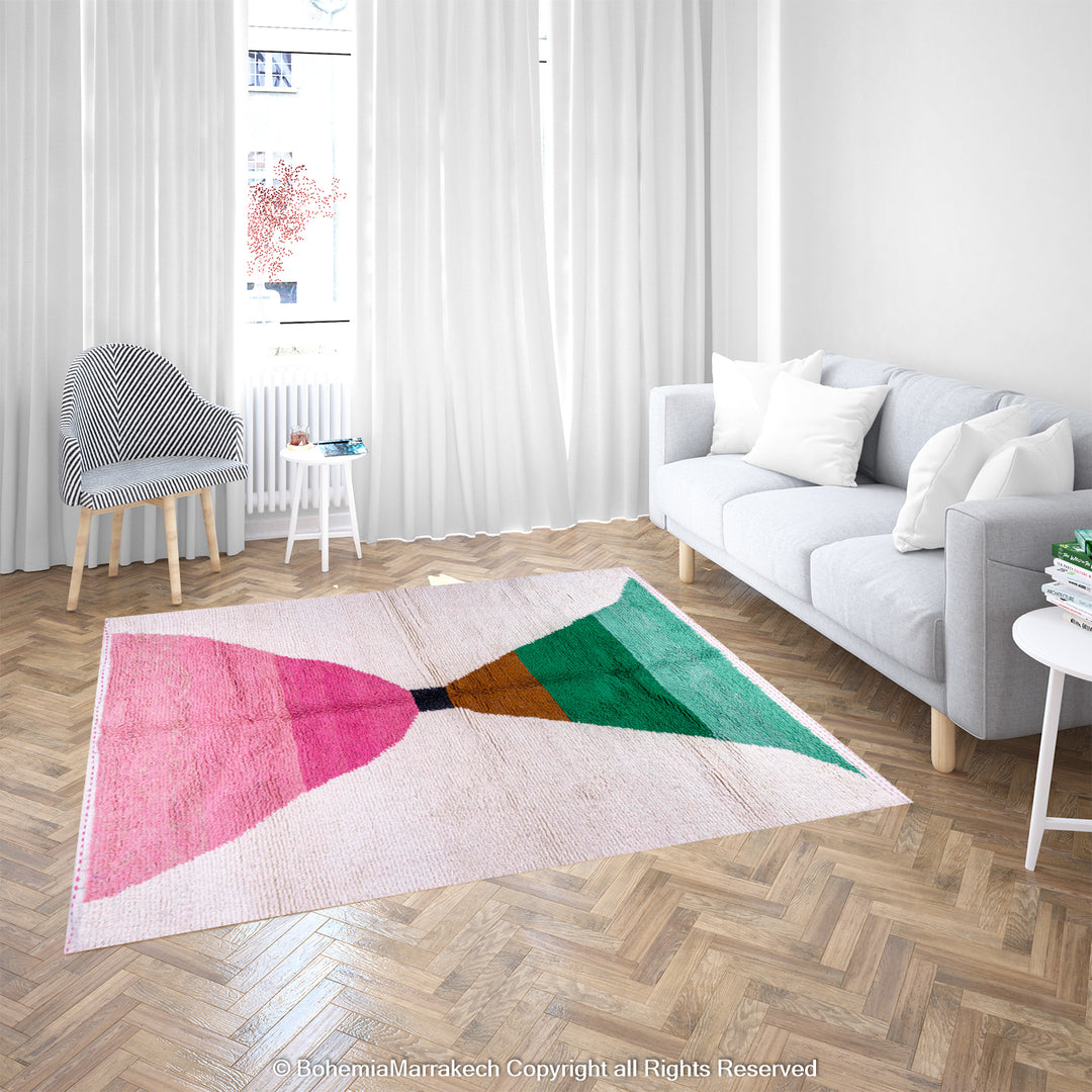 Modern Moroccan Berber rug with pink and green abstract design on wool, styled in bright living room. Moroccan wool rug.