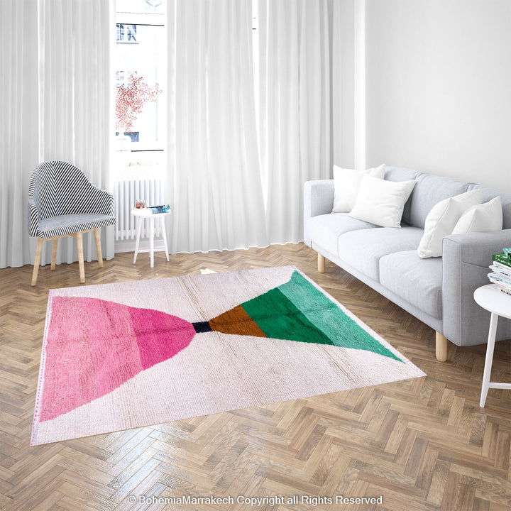 Modern Moroccan Berber rug with pink and green abstract design on wool, styled in bright living room. Moroccan wool rug.