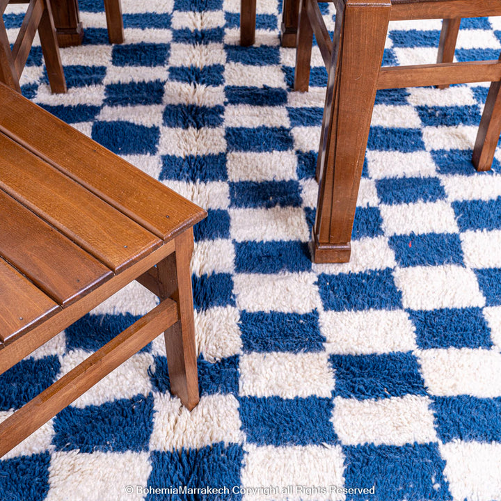 Blue and white checkered Moroccan wool rug with plush shag texture