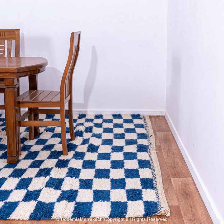 Blue and white checkered Moroccan wool rug with plush shag texture