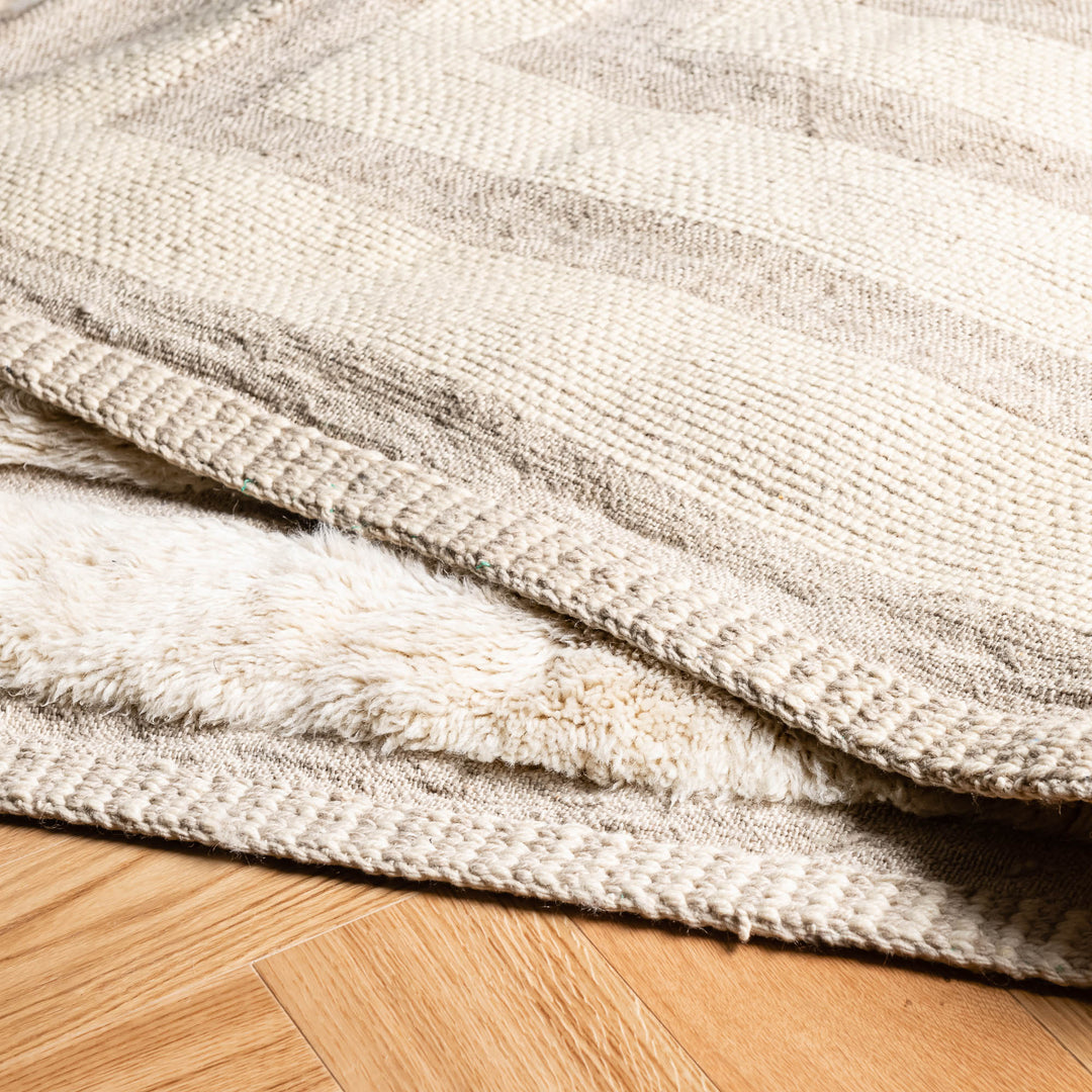 Geometric Beni Mrirt Moroccan wool rug with intricate patterns on wooden floor