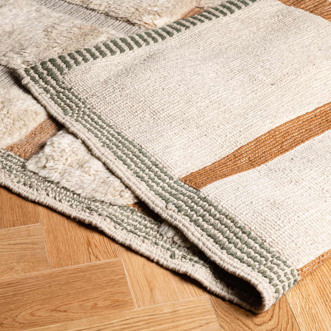 Geometric Beni Mrirt Moroccan Wool Rug in beige and earth tones, featuring hand-knotted patterns for living room decor.