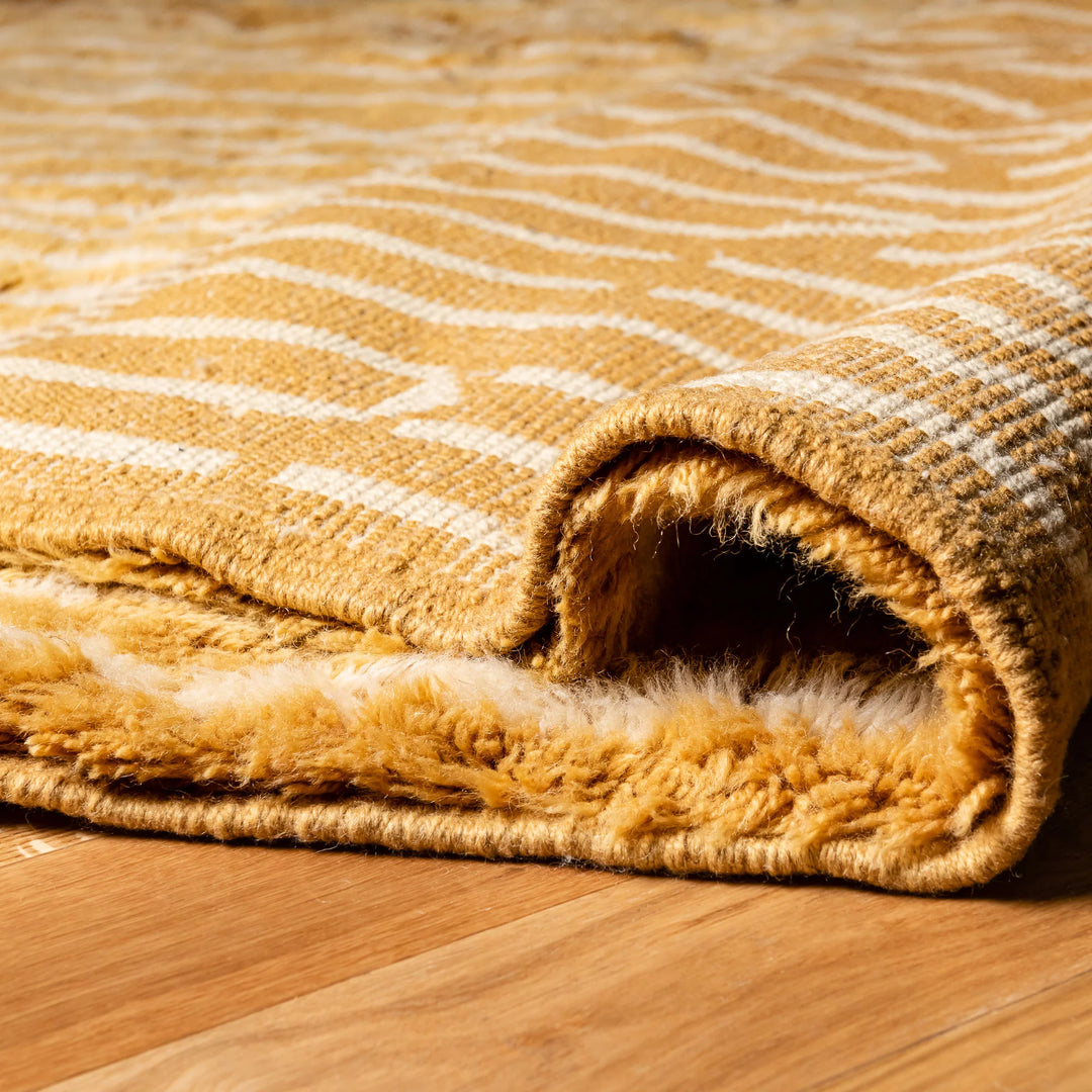 Golden Moroccan Beni Mrirt Rug with linear wool pattern, hand-knotted 100% Moroccan wool, showcasing traditional Berber craftsmanship.