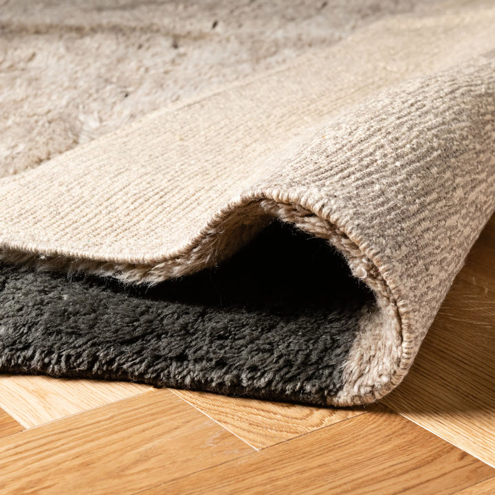 Handmade Moroccan wool rug in neutral tones with color block design, showcasing detailed texture and quality craftsmanship.