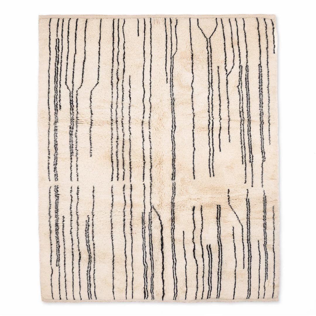 Handmade Moroccan wool rug with abstract linear design; minimalist Berber style, perfect for modern and bohemian interiors.