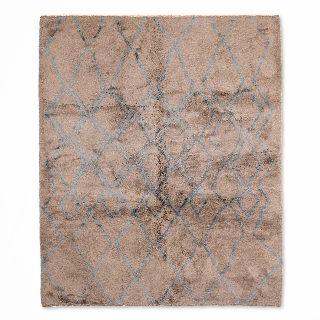 Handmade Moroccan rug with traditional Berber diamond pattern in blue, perfect for modern interiors; available as wool area rug.